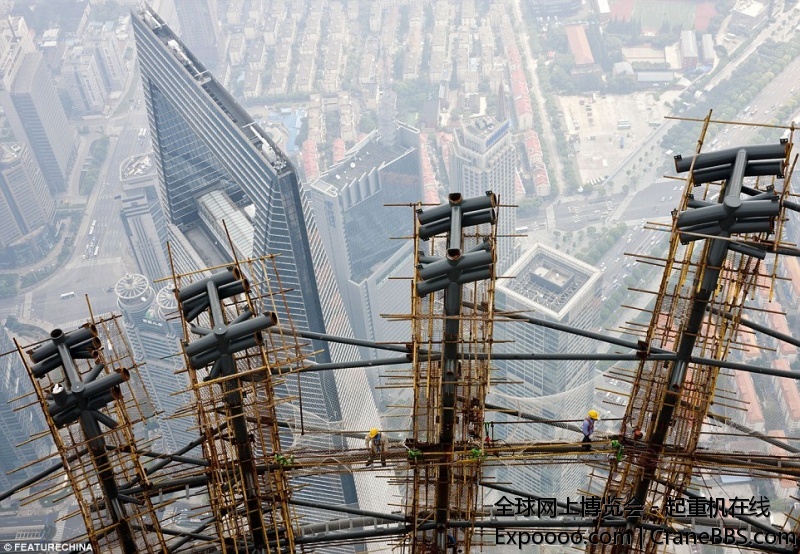 1407093369971_wps_4_Workers_work_on_top_of_Sh.jpg