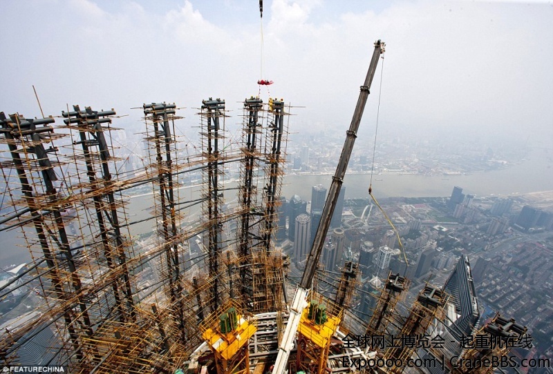 1407093847332_wps_11_Workers_work_on_top_of_Sh.jpg